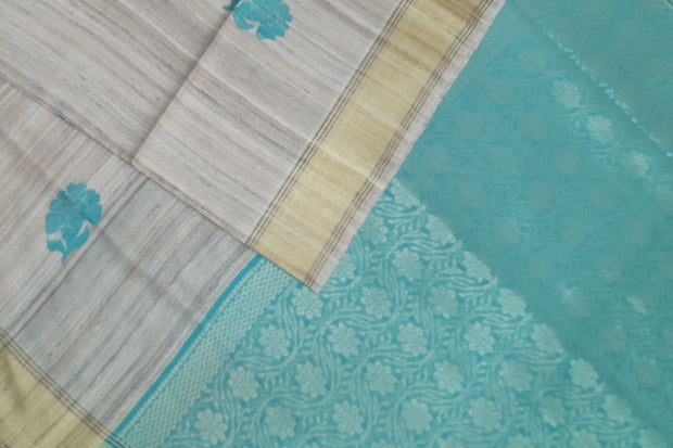 Desi tussar pure silk saree in teal blue  colour floral motifs on the body and a zari pallu in floral pattern