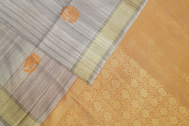 Desi tussar pure silk saree in orange  colour floral motifs on the body and a zari pallu in floral pattern