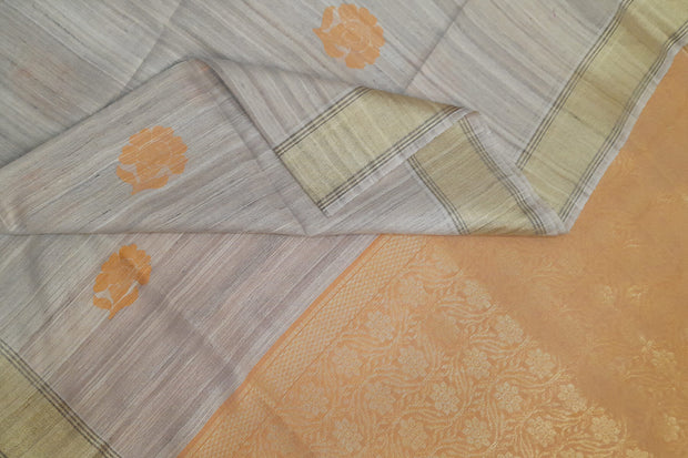 Desi tussar pure silk saree in orange  colour floral motifs on the body and a zari pallu in floral pattern