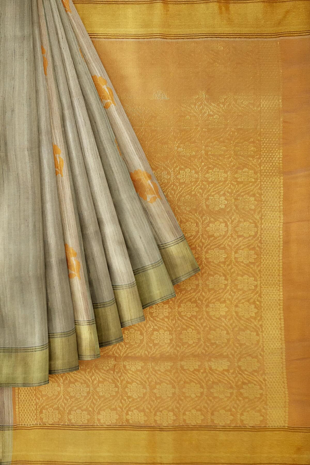 Desi tussar pure silk saree in orange  colour floral motifs on the body and a zari pallu in floral pattern